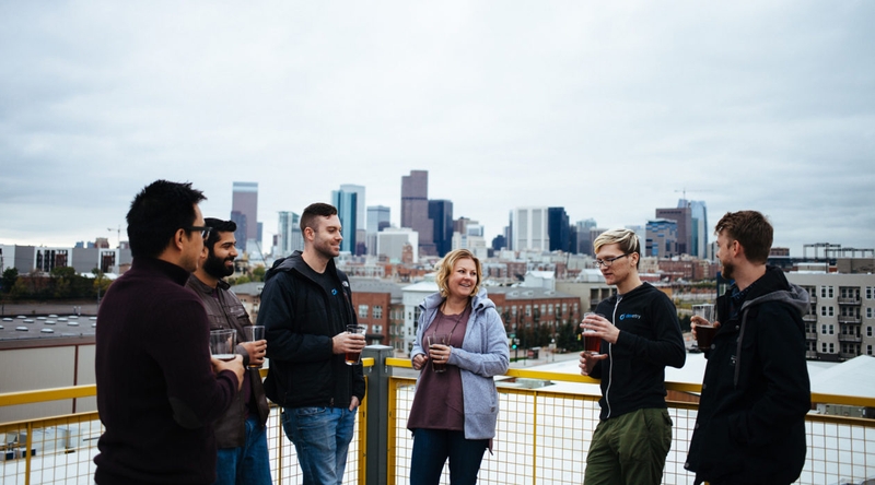 group drinking beer on rooftop